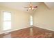 Bedroom with laminate flooring and large windows at 1121 Thoroughbred Nw Pl, Concord, NC 28027
