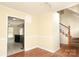 Cozy dining area features stylish lighting and convenient access to the kitchen and staircase at 1121 Thoroughbred Nw Pl, Concord, NC 28027
