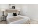 Bright bedroom with a cozy bed, stylish lamps, and modern decor at 114 S Shayna Rd, Troutman, NC 28166