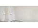 Light-filled bedroom with neutral walls, plush carpeting, and white doors at 114 S Shayna Rd, Troutman, NC 28166