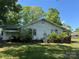 Exterior of the house showcasing the lush backyard and mature greenery creating a private and serene outdoor space at 1203 N Charlotte Ave, Monroe, NC 28110