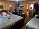 Bedroom with paneled walls, two beds, and storage shelves in a cozy atmosphere at 1203 N Charlotte Ave, Monroe, NC 28110