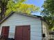 View of detached garage, shows building construction and roof condition at 1203 N Charlotte Ave, Monroe, NC 28110