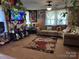 Cozy living room with a large brown couch and beautiful flower-patterned rug at 1203 N Charlotte Ave, Monroe, NC 28110