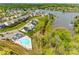 Aerial view of a community highlighting waterfront property, a pool, and picturesque scenery at 124 Rosebay Dr, Mooresville, NC 28117