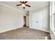 Bedroom with a ceiling fan, carpeted floor, white trim and a double-door closet at 124 Rosebay Dr, Mooresville, NC 28117