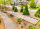 A well-maintained bocce ball court surrounded by mature trees and landscaping at 124 Rosebay Dr, Mooresville, NC 28117