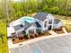 Community clubhouse featuring a pool, ample parking, and well-manicured landscaping at 124 Rosebay Dr, Mooresville, NC 28117