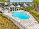 An expansive community pool with lounge chairs and a covered patio area, perfect for relaxation at 124 Rosebay Dr, Mooresville, NC 28117