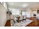Dining area with a wooden table set, neutral colors, and plenty of natural light at 124 Rosebay Dr, Mooresville, NC 28117