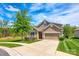 Charming home with well-maintained lawn, inviting curb appeal, and attached garage at 124 Rosebay Dr, Mooresville, NC 28117
