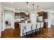 Spacious kitchen with granite countertops, stainless steel appliances, and a large center island at 124 Rosebay Dr, Mooresville, NC 28117