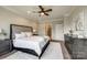 Spacious main bedroom with neutral walls, and ceiling fan, and well-maintained carpeted floor at 124 Rosebay Dr, Mooresville, NC 28117