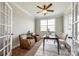 Cozy home office with comfortable seating, a work desk, and natural light from the window at 124 Rosebay Dr, Mooresville, NC 28117