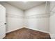 Walk-in closet with carpeted floor, white walls, and built-in shelving at 124 Rosebay Dr, Mooresville, NC 28117