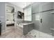 A modern bathroom features a separate shower, bathtub, and tile flooring at 12942 Blakemore Ave, Huntersville, NC 28078