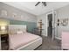 A charming bedroom featuring playful decor and accent wall at 12942 Blakemore Ave, Huntersville, NC 28078