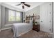 Cozy bedroom with natural light, carpeted floors and decorative headboard at 12942 Blakemore Ave, Huntersville, NC 28078