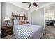 Comfortable bedroom with carpeted floors and wood decorative headboard at 12942 Blakemore Ave, Huntersville, NC 28078