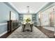 Stylish dining room with a modern chandelier and elegant furnishings at 12942 Blakemore Ave, Huntersville, NC 28078