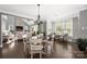 Cozy dining area open to the living room, filled with natural light from large windows at 12942 Blakemore Ave, Huntersville, NC 28078