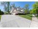 Spacious home featuring a large driveway and beautiful landscaping at 12942 Blakemore Ave, Huntersville, NC 28078