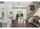 Inviting foyer with hardwood floors, decorative plates, and a view into the bright office space at 12942 Blakemore Ave, Huntersville, NC 28078