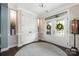 Elegant foyer with a round rug and decorative lighting at 12942 Blakemore Ave, Huntersville, NC 28078