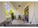 Cozy front porch with a swing, perfect for relaxing outdoors at 12942 Blakemore Ave, Huntersville, NC 28078
