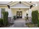 Inviting front porch with double doors and stylish decor at 12942 Blakemore Ave, Huntersville, NC 28078