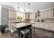 Open kitchen featuring granite countertops, a large island, and stainless steel appliances at 12942 Blakemore Ave, Huntersville, NC 28078