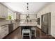Gourmet kitchen with granite counters, stainless appliances, and central island with seating at 12942 Blakemore Ave, Huntersville, NC 28078
