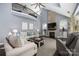 Open-concept living room with a stone fireplace, vaulted ceilings, and a view from the loft at 12942 Blakemore Ave, Huntersville, NC 28078