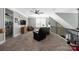 Comfortable upper living room with couches, TV, and ample light at 12942 Blakemore Ave, Huntersville, NC 28078
