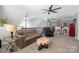 Cozy living room with plush seating, a unique coffee table, and a retro Coca Cola fridge at 12942 Blakemore Ave, Huntersville, NC 28078