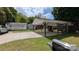 Spacious backyard featuring an outdoor kitchen, a shed, and a well-maintained lawn at 1306 Brantley Rd, Kannapolis, NC 28083