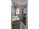 Cozy bathroom with updated sink, fixtures, and floors at 1306 Brantley Rd, Kannapolis, NC 28083