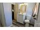 Bathroom featuring a vanity with storage, a toilet, and neutral colors at 1306 Brantley Rd, Kannapolis, NC 28083