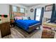 Rustic bedroom with hardwood floors, an area rug, and a wooden bedframe at 1306 Brantley Rd, Kannapolis, NC 28083