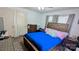 Bedroom with hardwood floors, a wooden bed frame, and bright natural light at 1306 Brantley Rd, Kannapolis, NC 28083