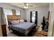 Bedroom features wood floors, a ceiling fan, and natural light at 1306 Brantley Rd, Kannapolis, NC 28083