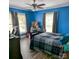 Comfortable bedroom features hardwood floors, neutral decor, and modern ceiling fan at 1306 Brantley Rd, Kannapolis, NC 28083