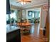 Open dining area with hardwood floors, view of living room, and lots of light at 1306 Brantley Rd, Kannapolis, NC 28083