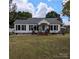 Charming single story home with a well-manicured lawn and inviting front porch at 1306 Brantley Rd, Kannapolis, NC 28083