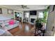 Cozy living room with a fireplace, hardwood floors, and plenty of natural light at 1306 Brantley Rd, Kannapolis, NC 28083