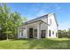 Expansive backyard featuring a covered patio with a fireplace, perfect for outdoor entertainment at 13453 Portside Ln, Lancaster, SC 29720