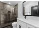 Modern bathroom featuring gray tiled shower, and a white vanity at 13453 Portside Ln, Lancaster, SC 29720