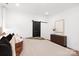Bedroom showcasing a barn door, dark wood floors, and a decorative wood cabinet at 13453 Portside Ln, Lancaster, SC 29720