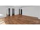Large bedroom featuring hardwood floors, black doors, and ample space at 13453 Portside Ln, Lancaster, SC 29720