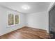Cozy bedroom featuring hardwood floors, natural light, and closet with door at 13453 Portside Ln, Lancaster, SC 29720